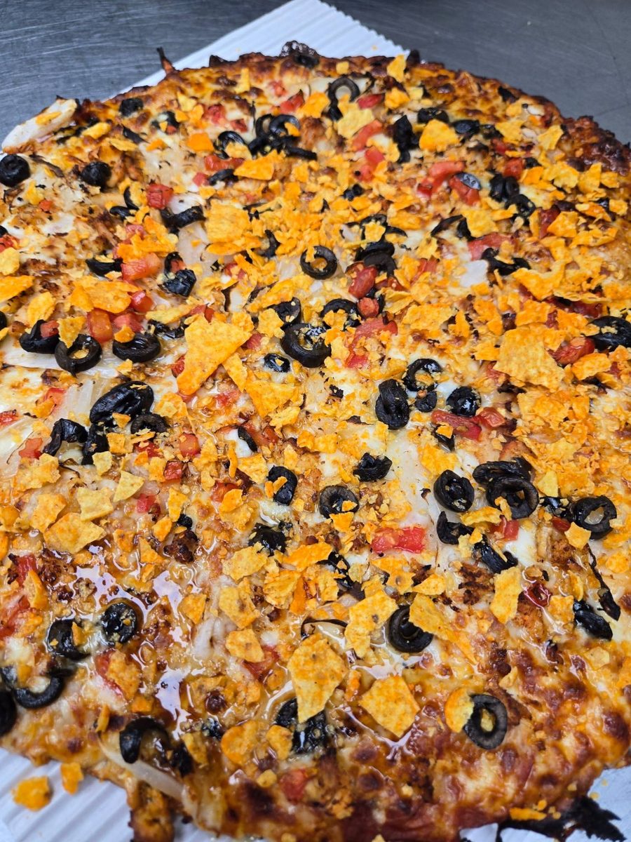 Tijuana pizza with tortilla chips and olives